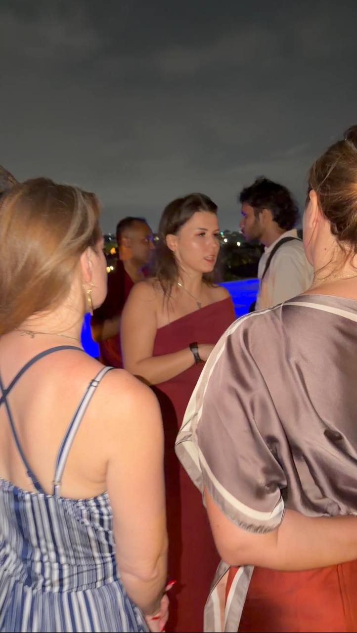 Mariia in conversation at an evening event